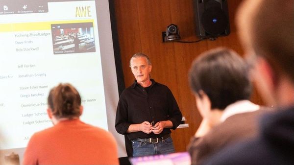 AWE’s principal investigator, Ludger Scherliess, briefs collaborators of initial analysis of early AWE data. Information from the NASA-funded mission is helping scientists better understand how weather on Earth affects weather in space. Credit: SDL/Allison Bills