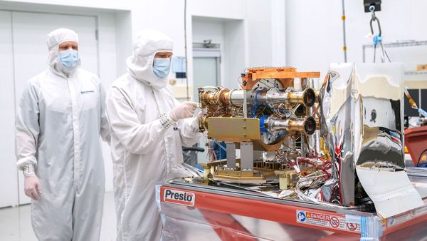 SDL Mechanical Engineer Matt Ralphs and Mechanical Engineering Associate Dave Griffin are shown in this image working on AWE's Opto-Mechanical Assembly in a cleanroom at SDL facilities on Innovation Campus. (Photo Credit: SDL/Allison Bills)